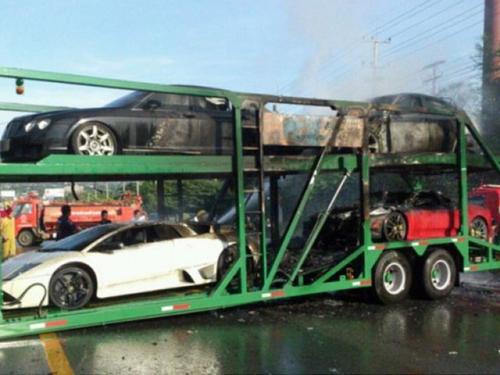 Supercars on truck in flames in Thailand-1