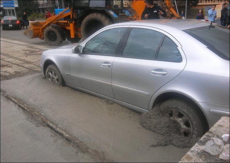 Mercedes-Benz E-Class driver struggles in wet cement