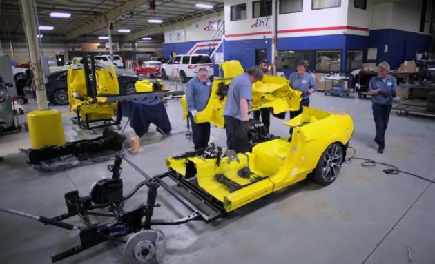 Ford prepares to fit a Mustang into an elevator
