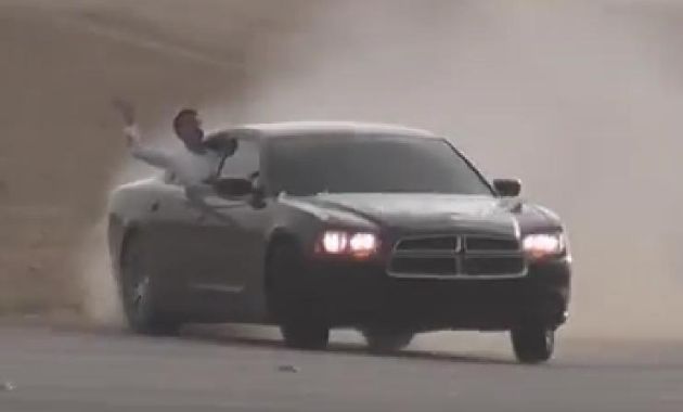 Dodge Charger sedan drifting at 220km/h in the Middle East