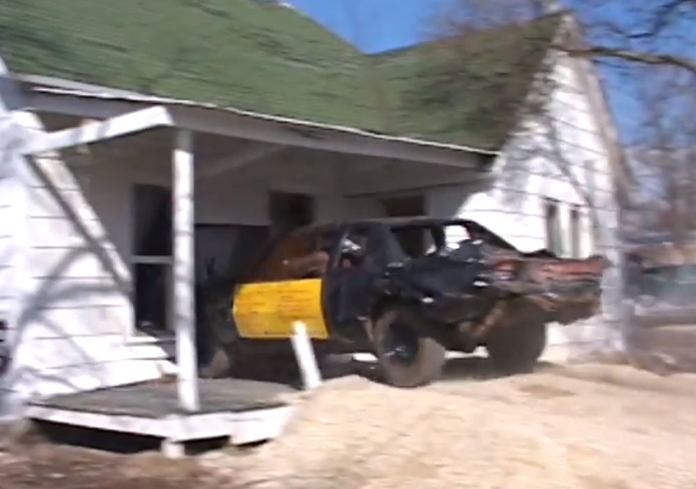 Crash derby car vs former meth lab house