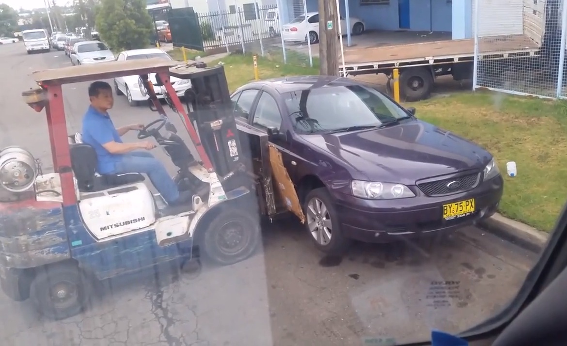 Sydney worker uses forklift to move legally parked car (video)