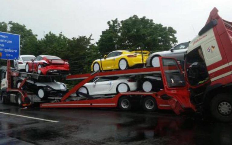 Truck hauling multiple Porsche Cayman GT4s gets rear-ended on autobahn