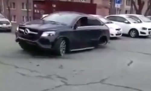 Woman in Russia crashes into 11 parked cars (video)