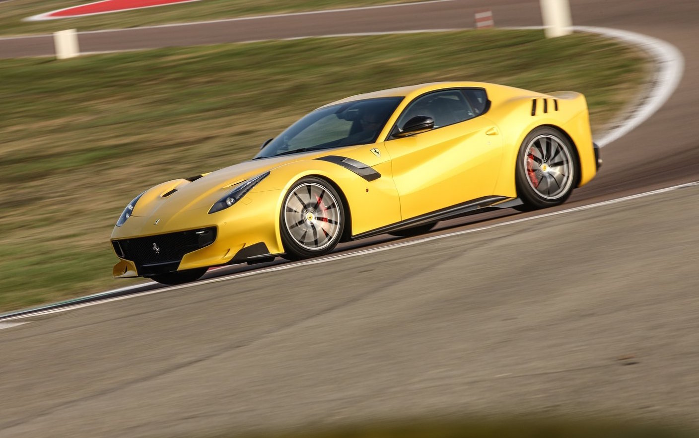 Ferrari V12 engines to remain non-turbo, hybrid instead – report