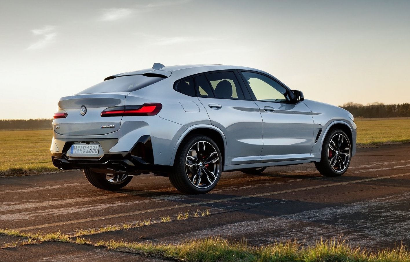 A Black BMW X4 M40i driving on the road