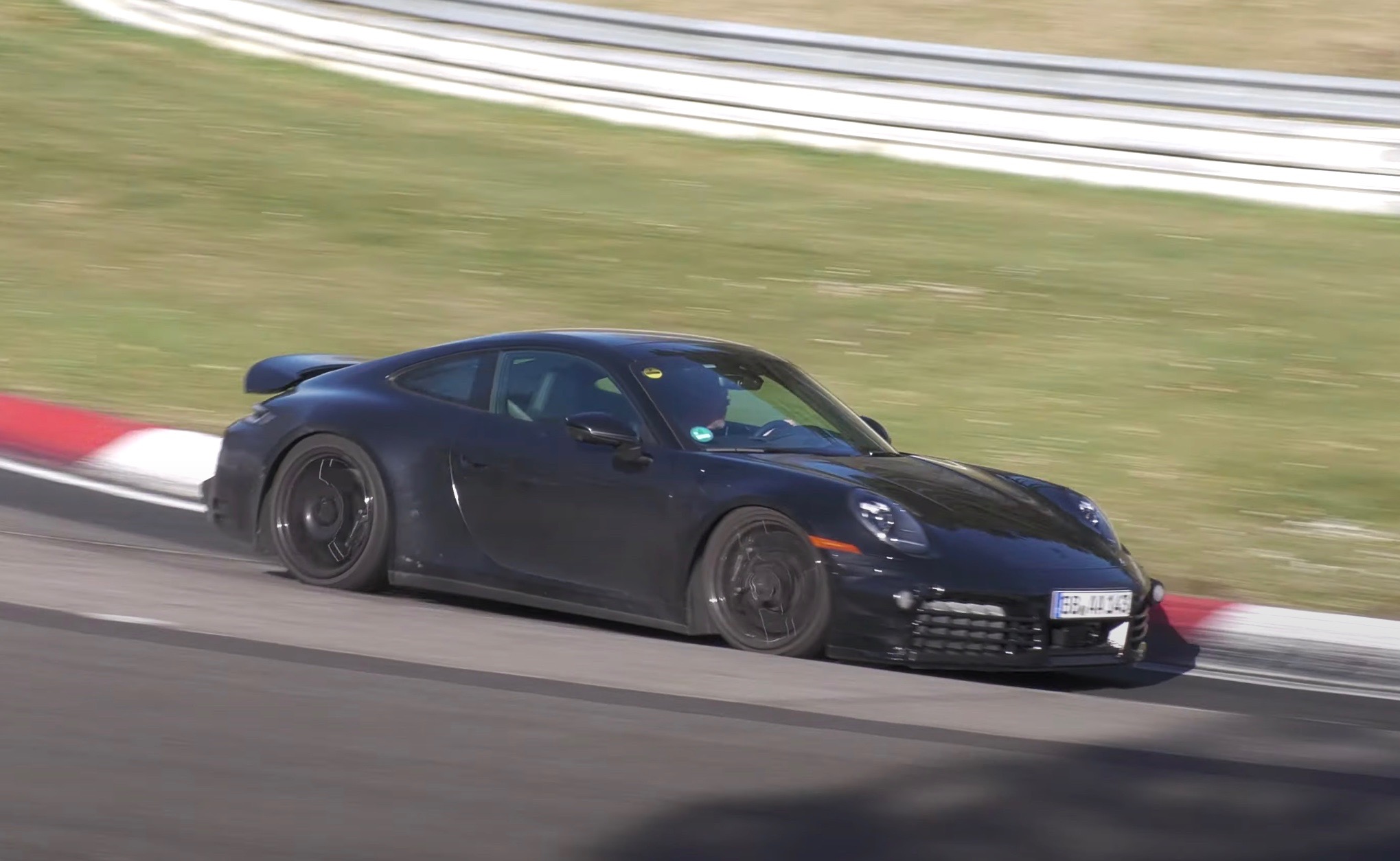 Porsche spotted testing first-ever 911 hybrid at Nurburgring (video)